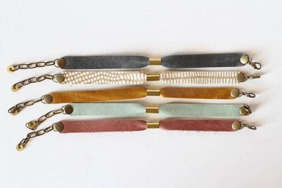 Permanent Baggage Narrow Leather Friendship Bracelet With Golden Brass Accent